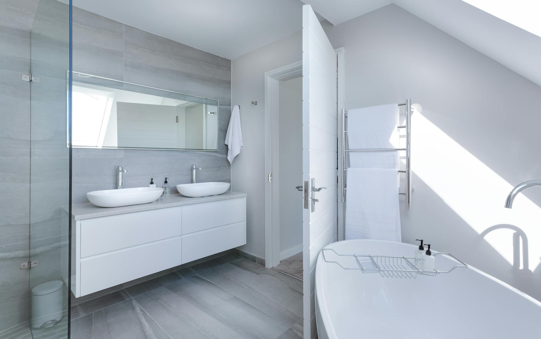 Bright double‑sink bathroom with modern fixtures